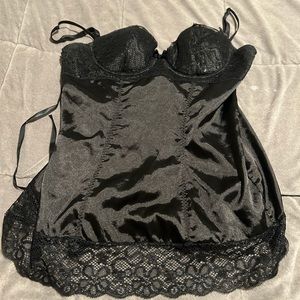 Black stretch baby doll with lace edges and lace up back